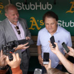 
              Chicago White Sox manager Tony La Russa, back right, talks to reporters in the dugout before a baseball game against the Oakland Athletics in Oakland, Calif., Sunday, Sept. 11, 2022. (AP Photo/Godofredo A. Vásquez)
            