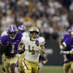 
              Georgia Tech running back Dontae Smith (4) runs the ball before scoring a touchdown in the first half of an NCAA college football game against Western Carolina, Saturday, Sept. 10, 2022, in Atlanta. (AP Photo/Brynn Anderson)
            