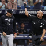 
              Home plate umpire Vic Carapazza ejects New York Yankees manager Aaron Boone from the game against the Tampa Bay Rays during the fifth inning of a baseball game, Sunday, Sept. 4, 2022, in St. Petersburg, Fla. (AP Photo/Scott Audette)
            