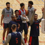 
              Washington Wizards players including Rui Hachimura, center, and Isaiah Todd (14) work out in Tokyo, Thursday, Sept. 29, 2022, ahead of the NBA preseason games in Japan. Japanese basketball fans will get to see NBA stars up close when the reigning league-champion Golden State Warriors take on the Washington Wizards in two preseason games. (AP Photo/Yuri Kageyama)J
            