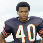 
              FILE - Chicago Bears football player Gale Sayers poses for a photo in 1970. There is a fine line between a Tom Brady and a Sayers. Whether you are a seven-time Super Bowl champion who plays well into his 40s like Brady or an all-time great running back knocked out of football during his prime like Sayers there is an element of luck to longevity in the NFL. (AP Photo/File)
            