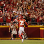 
              Kansas City Chiefs cornerback Jaylen Watson runs an interception back for a touchdown during the second half of an NFL football game against the Los Angeles Chargers Thursday, Sept. 15, 2022, in Kansas City, Mo. (AP Photo/Charlie Riedel)
            