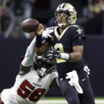 
              Tampa Bay Buccaneers linebacker Shaquil Barrett strips the ball form New Orleans Saints quarterback Jameis Winston during the first half of an NFL football game in New Orleans, Sunday, Sept. 18, 2022. The Saints recovered the ball. (AP Photo/Butch Dill)
            