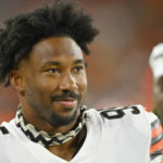 
              FILE - Cleveland Browns defensive end Myles Garrett stands on the field during an NFL preseason football game against the Chicago Bears, Saturday, Aug. 27, 2022, in Cleveland. Now, more focused, stronger and driven like never before to push himself beyond what he thought possible as he reaches a pivotal point in his NFL career, Garrett has his sights on a new target. He's seeking greatness. Iconic greatness. (AP Photo/David Richard, File)
            