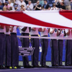 
              West Point cadets hold the American flag over the court at Arthur Ashe Stadium before the start of the women's single final between Ons Jabeur, of Tunisia, and Iga Swiatek, of Poland, at the U.S. Open tennis championships, Saturday, Sept. 10, 2022, in New York. (AP Photo/Charles Krupa)
            