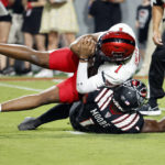 
              Texas Tech's Donovan Smith is sacked for a loss by North Carolina State's Isaiah Moore during the first half of an NCAA college football game in Raleigh, N.C., Saturday, Sept. 17, 2022. (AP Photo/Karl B DeBlaker)
            