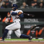 
              Houston Astros' Jose Altuve follows through on a double against the Baltimore Orioles in the first inning of a baseball game, Friday, Sept. 23, 2022, in Baltimore. Altuve was thrown out while trying for stretch the hit into a triple. (AP Photo/Gail Burton)
            