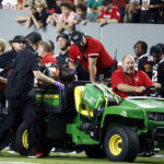 
              Texas Tech's Bryce Ramirez (54) is carted off the field by medical staff following suffering an unknown injury to his left leg during the first half of an NCAA college football game against North Carolina State in Raleigh, N.C., Saturday, Sept. 17, 2022. (AP Photo/Karl B DeBlaker)
            