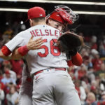 
              St. Louis Cardinals' Andrew Knizner and Ryan Helsley celebrate after defeating the Milwaukee Brewers in a baseball game to win the National League Central title Tuesday, Sept. 27, 2022, in Milwaukee. (AP Photo/Morry Gash)
            