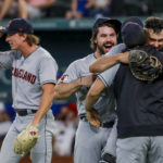 
              Cleveland Guardians players celebrate winning the American League Central after defeating the Texas Rangers in a baseball game in Arlington, Texas, Sunday, Sept. 25, 2022. (AP Photo/Gareth Patterson)
            