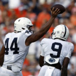 
              Penn State defensive end Chop Robinson (44) celebrates with Penn State cornerback Joey Porter Jr. (9) after recovering a fumble by Auburn quarterback T.J. Finley during the second half of an NCAA college football game Saturday, Sept. 17, 2022, in Auburn, Ala. (AP Photo/Butch Dill)
            