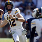 
              Missouri quarterback Brady Cook (12) throws a pass against Auburn during the second half of an NCAA college football game, Saturday, Sept. 24, 2022 in Auburn, Ala. (AP Photo/Butch Dill)
            
