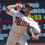 
              Minnesota Twins pitcher Ronny Henriquez throws in relief against the Los Angeles Angels in the fourth inning of a baseball game, Sunday, Sept 25, 2022, in Minneapolis. (AP Photo/Jim Mone)
            