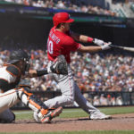 
              Philadelphia Phillies' J.T. Realmuto, right, hits a three-run home run in front of San Francisco Giants catcher Austin Wynns during the eighth inning of a baseball game in San Francisco, Sunday, Sept. 4, 2022. (AP Photo/Jeff Chiu)
            