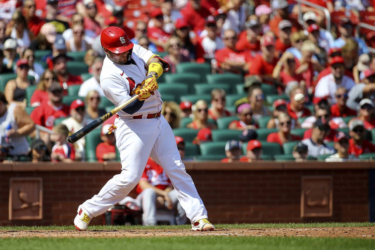 St. Louis Cardinals' Yadier Molina hits a two-run home run during the third inning in the first bas...