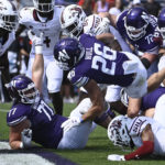 
              Northwestern running back Evan Hull (26) scores a touchdown against Southern Illinois during the first half of an NCAA college football game Saturday, Sept. 17, 2022, in Evanston, Ill. (AP Photo/Matt Marton
            