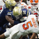 
              Georgia Tech defensive lineman D'Quan Douse sacks Clemson quarterback DJ Uiagalelei in the first half of an NCAA college football game, Monday, Sept. 5, 2022, in Atlanta. (AP Photo/Hakim Wright Sr.)
            