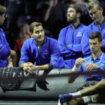 
              Team Europe's Roger Federer, second left looks up as he stands behind teammate Team Europe's Novak Djokovic, who is taking a drink at a change of ends as he plays against Team Wold'sFelix Auger-Allassime during their singles tennis match on third day of the Laver Cup tennis tournament at the O2 arena in London, Sunday, Sept. 25, 2022. (AP Photo/Kin Cheung)
            