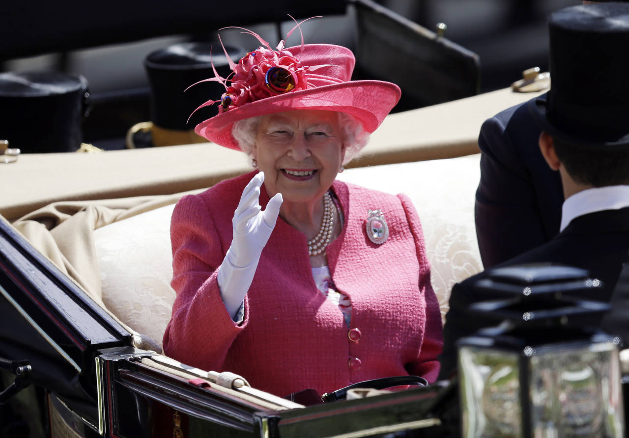 FILE - Britain's Queen Elizabeth II arrives on the third day of the Royal Ascot horse race meeting,...