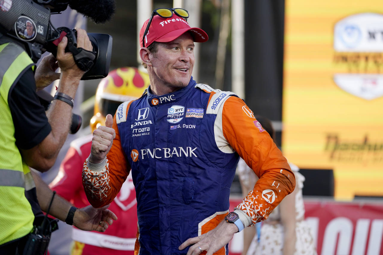 FILE - Scott Dixon celebrates after winning the IndyCar Music City Grand Prix auto race, Aug. 7, 20...