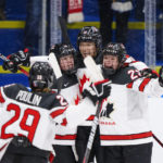 
              The players of Canada celebrate after Brianne Jenner has scored their second goal during The IIHF World Championship Woman's ice hockey gold medal match between USA and Canada in Herning, Denmark, Sunday, Sept. 4, 2022.. (Bo Amstrup/Ritzau Scanpix via AP)
            