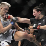 
              Irene Aldana hits Macy Chiasson in a 140-pound catchweight bout during the UFC 279 mixed martial arts event Saturday, Sept. 10, 2022, in Las Vegas. (AP Photo/John Locher)
            