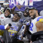 
              FILE - Los Angeles Rams players celebrate with the Lombardi Trophy after defeating the Cincinnati Bengals in the NFL Super Bowl 56 football game Sunday, Feb. 13, 2022, in Inglewood, Calif. The defending Super Bowl champion Los Angeles Rams host the Buffalo Bills in a battle of teams expected to challenge for the Lombardi Trophy to open the NFL season on Thursday night. (AP Photo/Mark J. Terrill, File
            