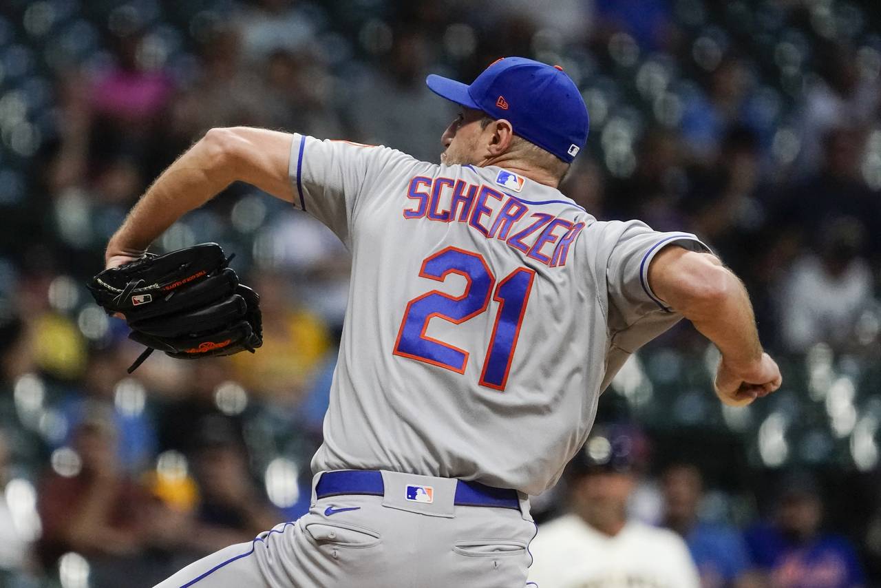 New York Mets starter Max Scherzer throws during the first inning of a baseball game against the Mi...