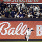 
              Fans react as New York Yankees left fielder Aaron Hicks (31) can't make the catch on an RBI double hit by Tampa Bay Rays' Randy Arozarena during the fourth inning of a baseball game Friday, Sept. 9, 2022, in New York. (AP Photo/Adam Hunger)
            