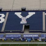 
              FILE - LaVell Edwards Stadium is empty of fans, during the coronavirus pandemic, before an NCAA college football game between BYU and Troy on Saturday, Sept. 26, 2020, in Provo, Utah. An investigation by Brigham Young University into allegations that fans engaged in racial heckling and uttered racial slurs at a Duke volleyball player last month found no evidence to support the claim. (AP Photo/Rick Bowmer, Pool File)
            