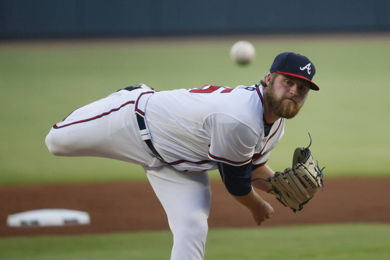Atlanta Braves starting pitcher Bryce Elder throws during the first inning of the team's baseball g...