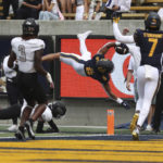 
              California running back Jaydn Ott (6) dives for a touchdown against UNLV during the first half of an NCAA college football game in Berkeley, Calif., Saturday, Sept. 10, 2022. (AP Photo/Jed Jacobsohn)
            