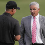 
              PGA Commissioner Jay Monahan, right, speaks with International team captain Trevor Immelman after the USA team won a singles match at the Presidents Cup golf tournament at the Quail Hollow Club, Sunday, Sept. 25, 2022, in Charlotte, N.C. (AP Photo/Chris Carlson)
            