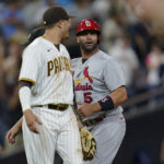 
              San Diego Padres third baseman Manny Machado, left, jokes with St. Louis Cardinals' Albert Pujols after the Padres' 5-0 win in a baseball game Tuesday, Sept. 20, 2022, in San Diego. (AP Photo/Gregory Bull)
            