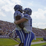 
              Duke running back Jordan Waters (7) celebrates his touchdown with tight end Cole Finney (82) against Northwestern during the first half of an NCAA college football game, Saturday, Sept.10, 2022, in Evanston, Ill. (AP Photo/David Banks)
            