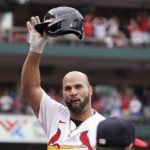 
              St. Louis Cardinals' Albert Pujols tips his cap after hitting a two-run home run during the eighth inning of a baseball game against the Chicago Cubs Sunday, Sept. 4, 2022, in St. Louis. (AP Photo/Jeff Roberson)
            