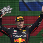 
              Red Bull driver Max Verstappen of the Netherlands lifts his trophy on the podium after winning the Formula One Dutch Grand Prix auto race, at the Zandvoort racetrack, in Zandvoort, Netherlands, Sunday, Sept. 4, 2022. (AP Photo/Peter Dejong)
            