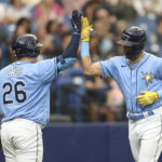
              Tampa Bay Rays' Jose Siri , right, celebrates with teammate Ji-Man Choi (26) after hitting a solo home run in the second inning of a baseball game against the Texas Rangers, Sunday, Sept. 18, 2022, in St. Petersburg, Fla. (AP Photo/Mark LoMoglio)
            