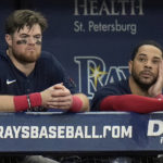 
              Boston Red Sox's Christian Arroyo, left, and Tommy Pham look on during the ninth inning of a baseball game against the Tampa Bay Rays Wednesday, Sept. 7, 2022, in St. Petersburg, Fla. (AP Photo/Chris O'Meara)
            