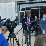 
              Attorney Bakari Sellers, center, speaks with reporters during a news conference announcing a cheerleading abuse lawsuit filed in Tennessee on Tuesday, Sept. 27, 2022, in Memphis, Tenn. (AP Photo/Adrian Sainz)
            
