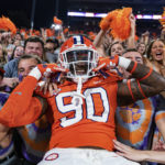 
              Clemson defensive tackle Jabriel Robinson poses with fans in the student section at the start of the team's NCAA college football game against Louisiana Tech on Saturday, Sept. 17, 2022, in Clemson, S.C. (AP Photo/Jacob Kupferman)
            