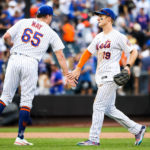 
              New York Mets' relief pitcher Trevor Maylow-fives first baseman Pete Alonso after they defeated the Pittsburgh Pirates in a baseball game, Sunday, Sept. 18, 2022, in New York. (AP Photo/Julia Nikhinson)
            