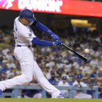 
              Los Angeles Dodgers' Trayce Thompson hits a three-run home run during the seventh inning of a baseball game against the San Diego Padres Sunday, Sept. 4, 2022, in Los Angeles. (AP Photo/Mark J. Terrill)
            