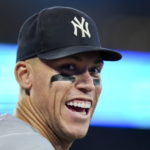 
              New York Yankees center fielder Aaron Judge smiles to the crowd during the ninth inning of the team's baseball game against the Toronto Blue Jays on Tuesday, Sept. 27, 2022, in Toronto. (Nathan Denette/The Canadian Press via AP)
            