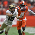 
              Purdue wide receiver Charlie Jones, left, reaches for a pass as Syracuse defensive back Garrett Williams defends during the first half of an NCAA college football game in Syracuse, N.Y., Saturday, Sept. 17, 2022. (AP Photo/Adrian Kraus)
            