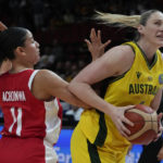 
              Australia's Lauren Jackson, right, attempts to get past Canada's Natalie Achonwa during their bronze medal game at the women's Basketball World Cup in Sydney, Australia, Saturday, Oct. 1, 2022. (AP Photo/Mark Baker)
            