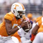 
              Tennessee quarterback Hendon Hooker (5) runs for yardage during the first half of an NCAA college football game against Florida, Saturday, Sept. 24, 2022, in Knoxville, Tenn. (AP Photo/Wade Payne)
            