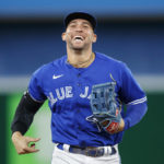 
              Toronto Blue Jays center fielder George Springer heads to the dugout during a break in baseball game action against the New York Yankees in Toronto, Monday, Sept. 26, 2022. (Cole Burston/The Canadian Press via AP)
            
