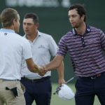 
              Davis Riley, right, shakes hands with Peter Malnati after they finished the first round of the Sanderson Farms Championship golf tournament in Jackson, Miss., Thursday, Sept. 29, 2022. (AP Photo/Rogelio V. Solis)
            