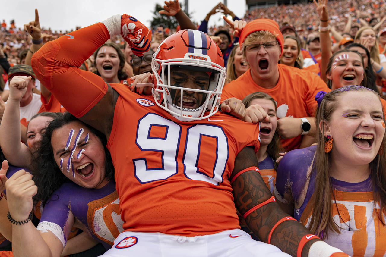 Clemson Tigers defensive tackle Jabriel Robinson (90) pumps up the crowd before an NCAA college foo...